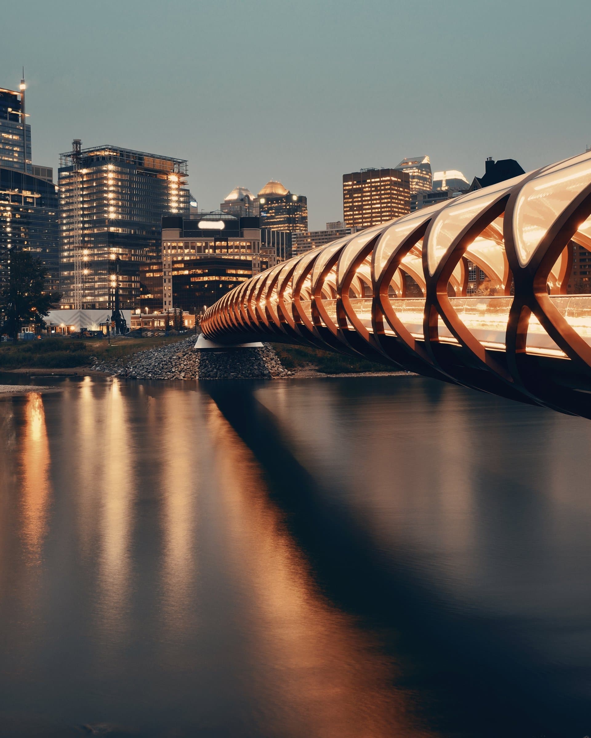 The Peace Bridge and the Calgary skyline at dusk